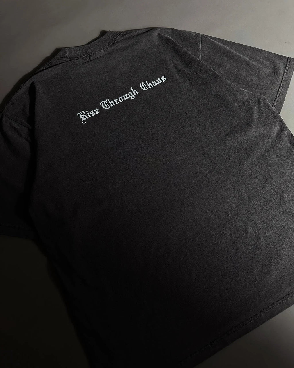 RISE THROUGH CHAOS “OVERSIZED” TEE IN VINTAGE BLACK