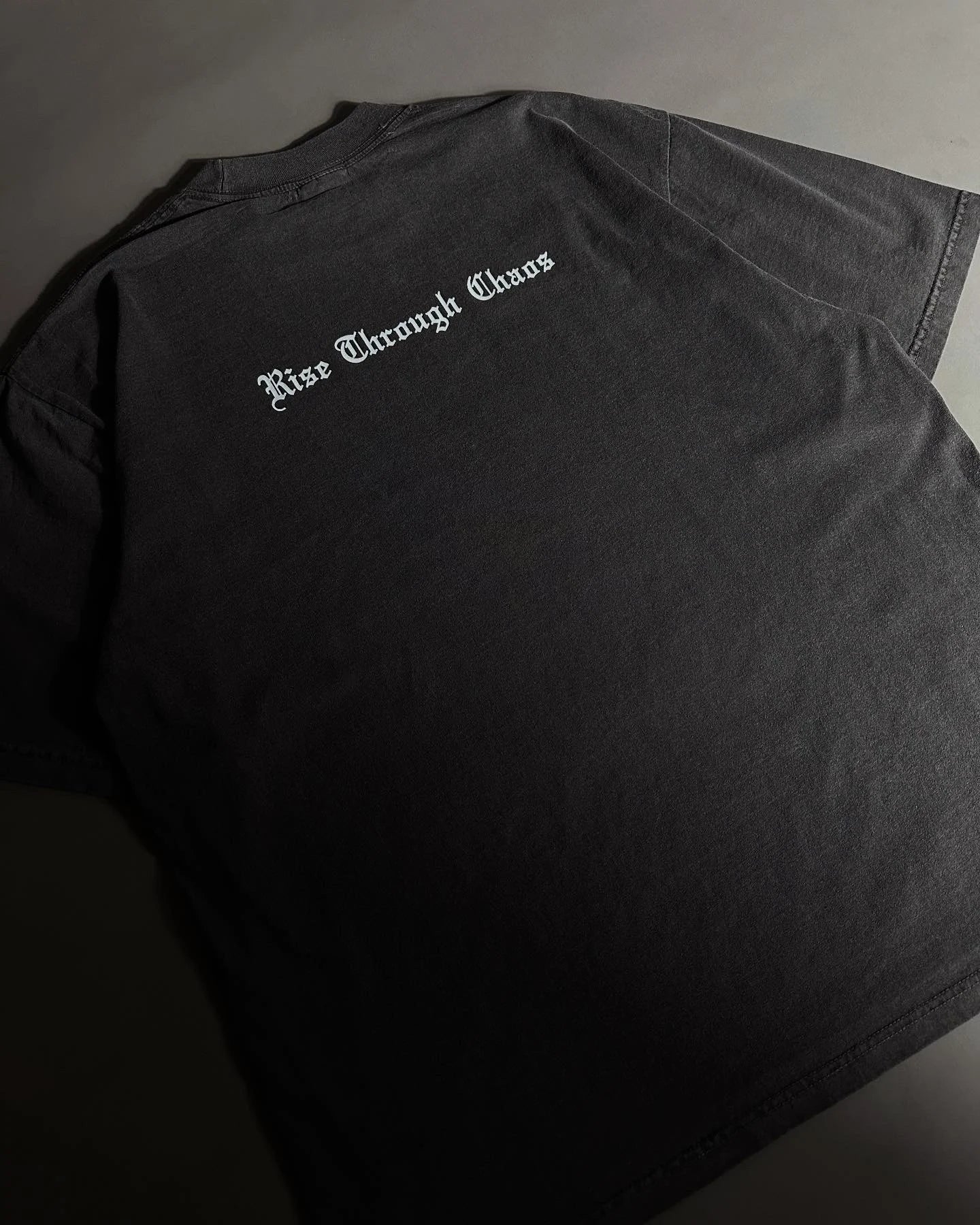 RISE THROUGH CHAOS “OVERSIZED” TEE IN VINTAGE BLACK