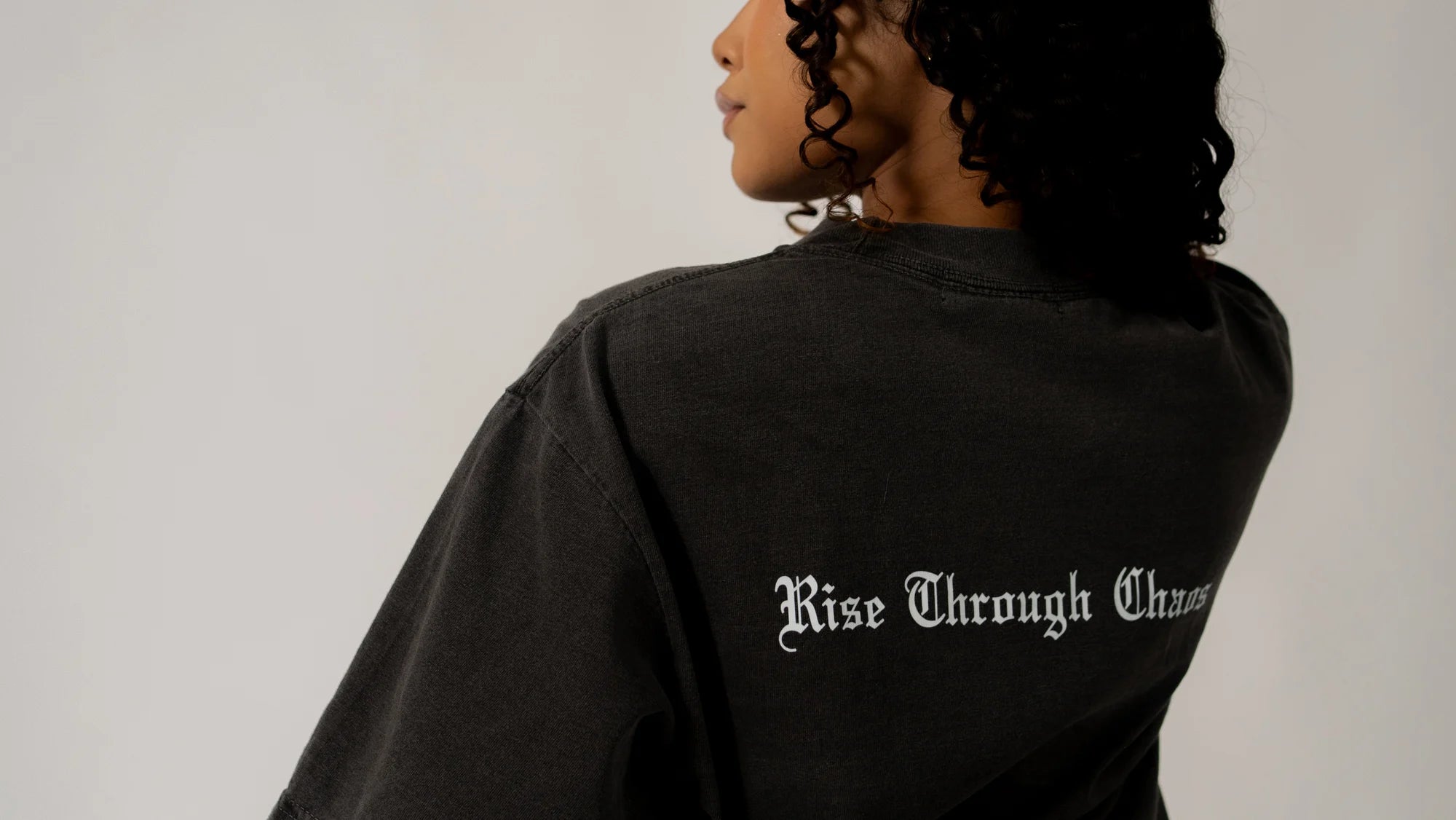 RISE THROUGH CHAOS “OVERSIZED” TEE IN VINTAGE BLACK